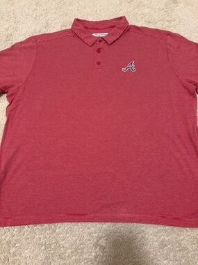 Tommy Bahama means polo shirt featuring Atlanta Braves embroidered logo.